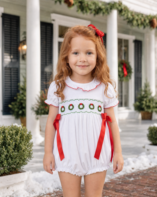 Elsie Smocked Bubble with Red Bows — model photo