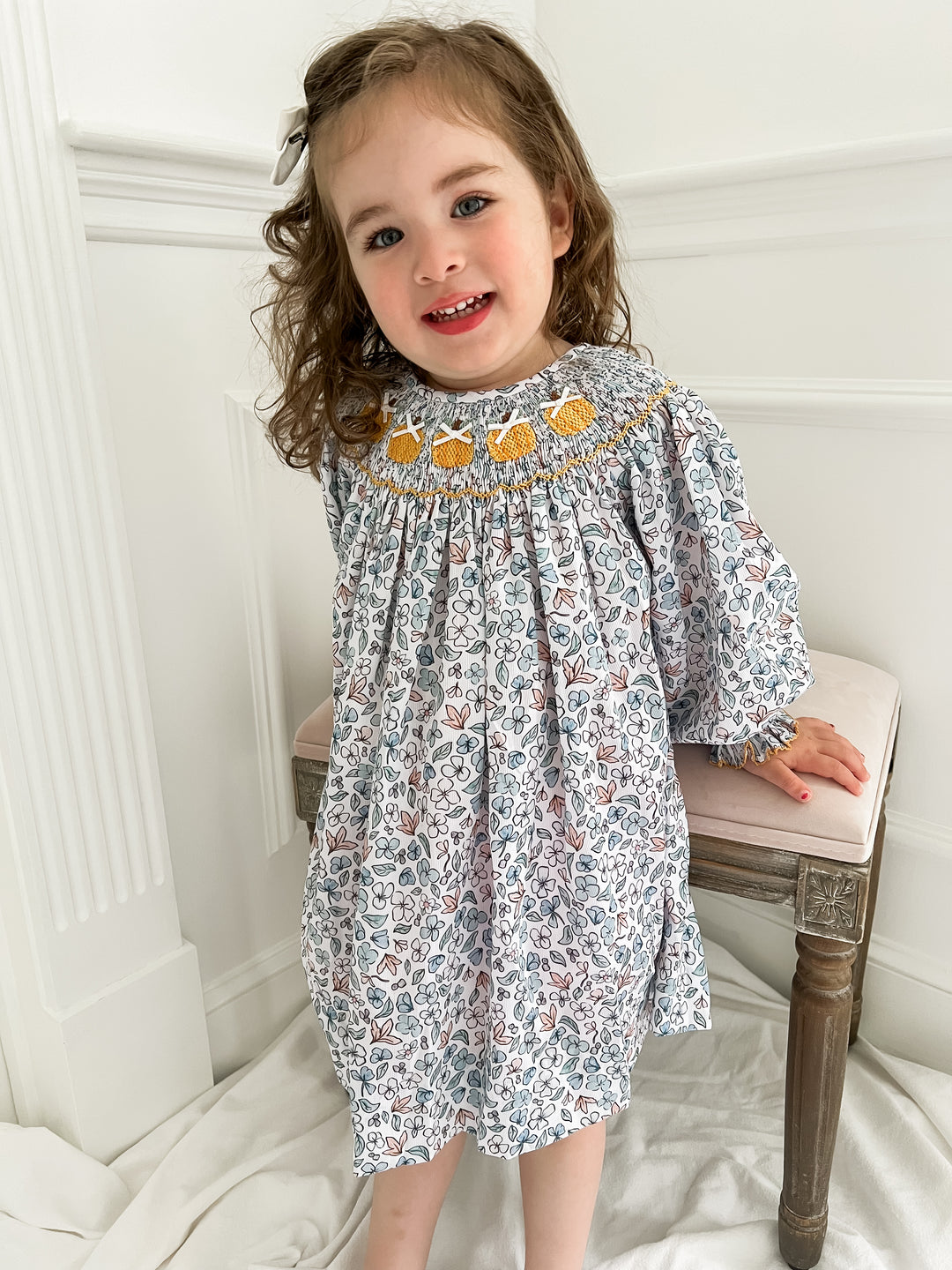 Colette Blue Floral and Pumpkin Smocked Dress