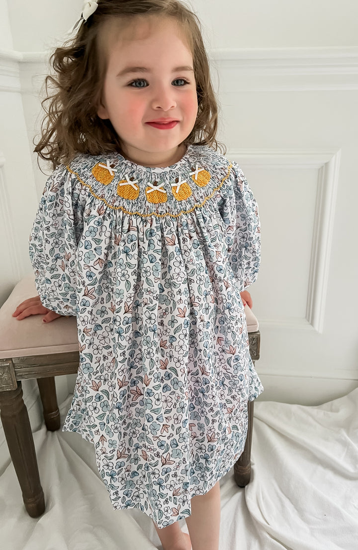 Colette Blue Floral and Pumpkin Smocked Dress