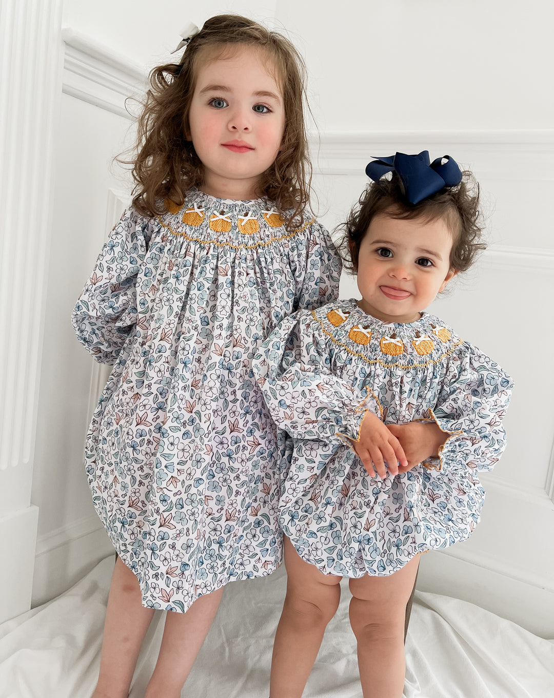 Colette Blue Floral and Pumpkin Smocked Dress