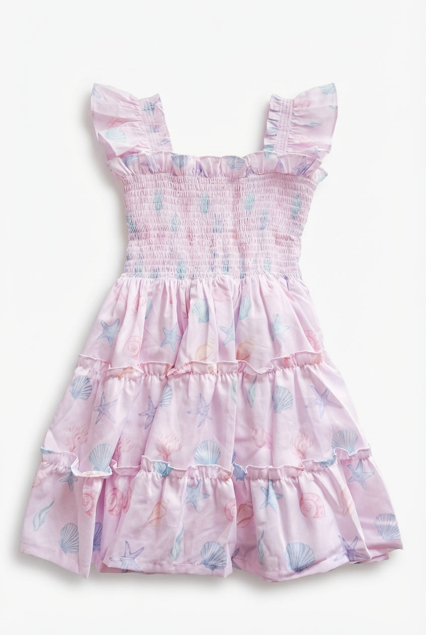 Pink girls dress with seashell print and flutter sleeves