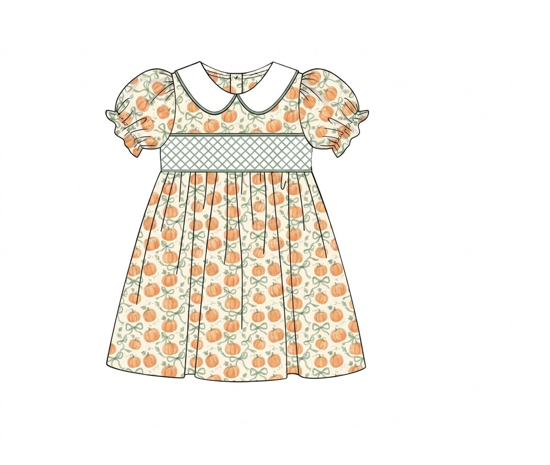 Ivory pumpkin print dress with green lattice smocked waist