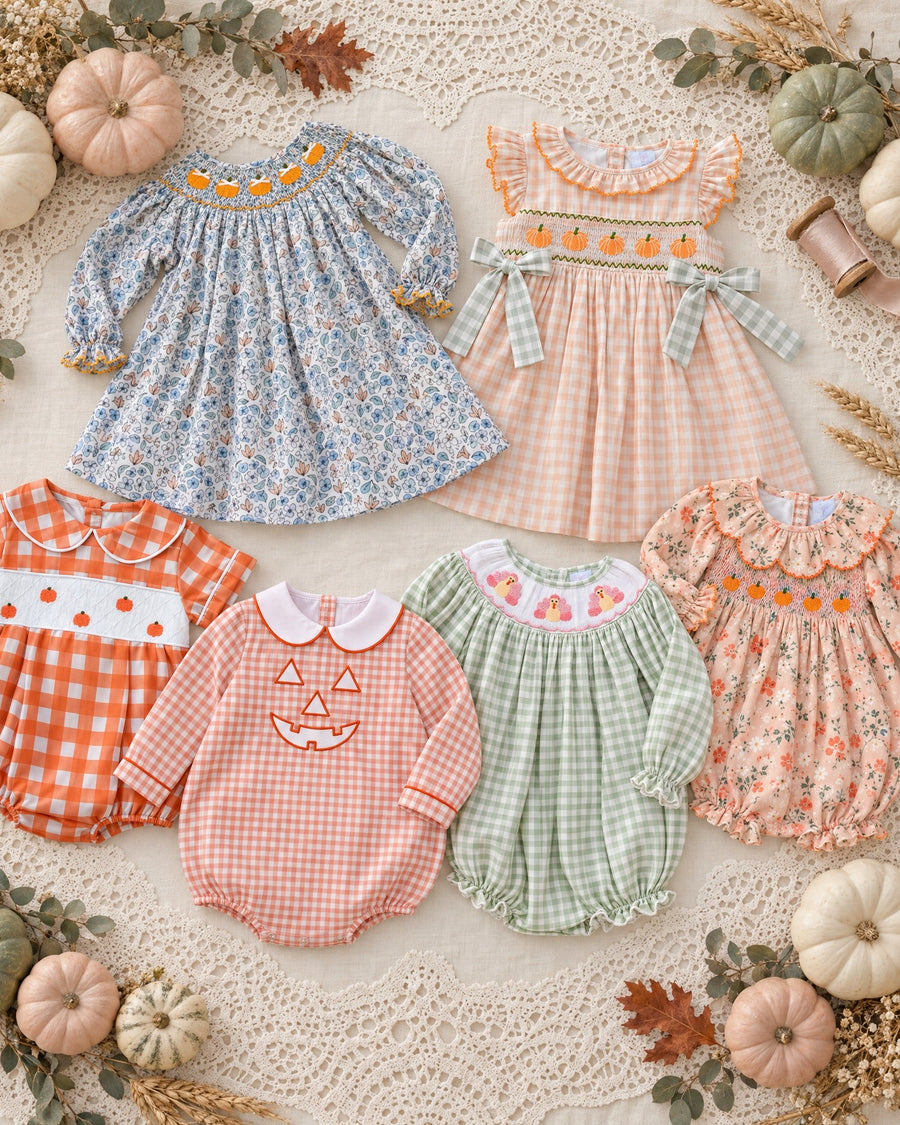 Six fall heirlooms laid on antique lace with little pumpkins