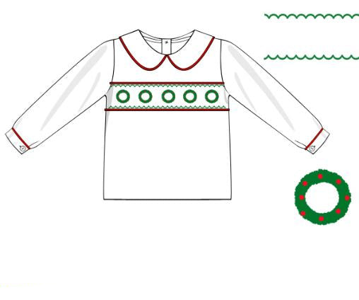 White smocked dress with green wreath embroidery and red piping